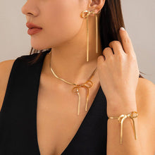 Load image into Gallery viewer, HERRINGBONE SNAKE CHAIN LONG BOW EARRINGS | GOLD